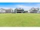 Large backyard with ample green space, adjacent to other well-maintained properties at 101 River Walk Pkwy, Euharlee, GA 30145