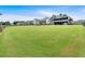 Vast backyard offers plenty of space for activities, complemented by neighboring houses and fencing at 101 River Walk Pkwy, Euharlee, GA 30145