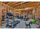 Spacious unfinished basement featuring exposed wood beams, ready for your customization and featuring a home gym space at 101 River Walk Pkwy, Euharlee, GA 30145
