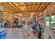 Spacious unfinished basement with exposed wood beams, room to customize to your liking and a walk out door at 101 River Walk Pkwy, Euharlee, GA 30145