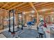 Spacious unfinished basement featuring exposed wood beams, ready for your customization and featuring a home gym space at 101 River Walk Pkwy, Euharlee, GA 30145