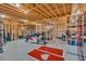 Spacious unfinished basement featuring exposed wood beams, ready for your customization and featuring a home gym space at 101 River Walk Pkwy, Euharlee, GA 30145
