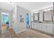 Bathroom showcases double vanity, framed mirrors, and tiled floors at 101 River Walk Pkwy, Euharlee, GA 30145