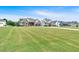Picturesque neighborhood with well-manicured lawns and beautiful homes under a clear blue sky at 101 River Walk Pkwy, Euharlee, GA 30145