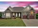 Charming front exterior with stone accents, well-manicured lawn and three car garage at 101 River Walk Pkwy, Euharlee, GA 30145