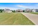 Beautiful homes sit on sprawling green lawns under a clear blue sky at 101 River Walk Pkwy, Euharlee, GA 30145