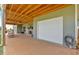 Exterior view showcases the covered patio, stone fireplace, and convenient garage access at 101 River Walk Pkwy, Euharlee, GA 30145