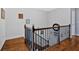 Wooden banister lines a staircase, leading to a higher floor in the home at 101 River Walk Pkwy, Euharlee, GA 30145
