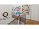 Upstairs hallway showcases dark wooden staircase and stylish decorations at 101 River Walk Pkwy, Euharlee, GA 30145