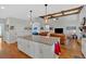 Bright kitchen with hardwood floors and granite island, flowing into the cozy living space at 101 River Walk Pkwy, Euharlee, GA 30145