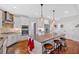 Bright kitchen featuring a granite island, stainless appliances, and ample storage at 101 River Walk Pkwy, Euharlee, GA 30145
