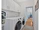 Modern laundry room with cabinetry and updated washer and dryer at 101 River Walk Pkwy, Euharlee, GA 30145