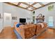 Spacious living room features vaulted ceilings with exposed wood beams and a stone fireplace at 101 River Walk Pkwy, Euharlee, GA 30145