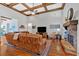 Cozy living room featuring hardwood floors, stone fireplace, and comfortable seating at 101 River Walk Pkwy, Euharlee, GA 30145