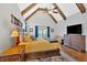 Large main bedroom featuring exposed beams, a ceiling fan, and hardwood floors at 101 River Walk Pkwy, Euharlee, GA 30145