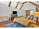 Vaulted ceiling main bedroom featuring exposed beams, hardwood floors and a sliding barn door at 101 River Walk Pkwy, Euharlee, GA 30145