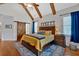 Bright main bedroom boasts vaulted ceilings, exposed beams, and stylish decor at 101 River Walk Pkwy, Euharlee, GA 30145