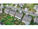 An aerial shot showcasing the backyard of several homes in a suburban neighborhood with manicured lawns at 1767 Weatherbrook Cir, Lawrenceville, GA 30043