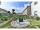 Seating around a fire pit creates a cozy backyard gathering spot at 1767 Weatherbrook Cir, Lawrenceville, GA 30043