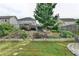 Beautiful backyard features a terraced garden, stone-lined beds, and a small retaining wall at 1767 Weatherbrook Cir, Lawrenceville, GA 30043