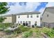 Green, landscaped backyard offering space for outdoor relaxation and entertainment at 1767 Weatherbrook Cir, Lawrenceville, GA 30043