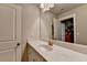 A clean bathroom features a white countertop and cabinets and a door to the walk-in closet at 1767 Weatherbrook Cir, Lawrenceville, GA 30043