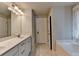 Bright bathroom features double vanity, tub, and neutral colors, offering a clean and modern aesthetic at 1767 Weatherbrook Cir, Lawrenceville, GA 30043