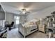 Comfortable bedroom with plush carpet, ceiling fan, and neutral decor at 1767 Weatherbrook Cir, Lawrenceville, GA 30043