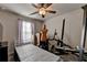 A comfortable room features a ceiling fan and curtained windows at 1767 Weatherbrook Cir, Lawrenceville, GA 30043
