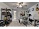 This extra room features a ceiling fan and an array of musical instruments at 1767 Weatherbrook Cir, Lawrenceville, GA 30043