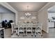 Dining room with hardwood floors and an ornate white table and chairs at 1767 Weatherbrook Cir, Lawrenceville, GA 30043