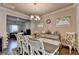 Dining room with hardwood floors and an ornate white table and chairs at 1767 Weatherbrook Cir, Lawrenceville, GA 30043