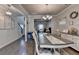 Dining room with hardwood floors and an ornate white table and chairs at 1767 Weatherbrook Cir, Lawrenceville, GA 30043
