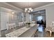 Dining room with hardwood floors and an ornate white table and chairs at 1767 Weatherbrook Cir, Lawrenceville, GA 30043