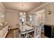 Traditional dining room features hardwood floors and an elegant chandelier at 1767 Weatherbrook Cir, Lawrenceville, GA 30043