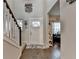 Inviting foyer with hardwood floors, a staircase, and neutral paint at 1767 Weatherbrook Cir, Lawrenceville, GA 30043
