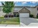 Charming two-story home with a well-manicured lawn and an attached two car garage at 1767 Weatherbrook Cir, Lawrenceville, GA 30043