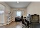 Stylish home office featuring hardwood floors, neutral paint, and bright light at 1767 Weatherbrook Cir, Lawrenceville, GA 30043