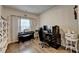 Stylish home office featuring hardwood floors, neutral paint, and bright light at 1767 Weatherbrook Cir, Lawrenceville, GA 30043