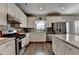 Spacious kitchen featuring stainless steel appliances and a central island with granite countertops at 1767 Weatherbrook Cir, Lawrenceville, GA 30043