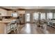 Bright eat-in kitchen with stainless steel appliances, island seating, and hardwood floors adjacent to the dining area at 1767 Weatherbrook Cir, Lawrenceville, GA 30043