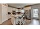 Modern kitchen featuring stainless steel appliances, white cabinets, and an island with bar stool seating at 1767 Weatherbrook Cir, Lawrenceville, GA 30043
