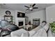 Cozy living room features a fireplace, hardwood floors, and an abundance of natural light at 1767 Weatherbrook Cir, Lawrenceville, GA 30043