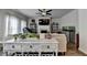 Bright open-concept living room featuring a fireplace, hardwood floors, and an abundance of natural light at 1767 Weatherbrook Cir, Lawrenceville, GA 30043
