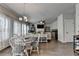 Bright living and dining area with hardwood floors, natural light, and a fireplace at 1767 Weatherbrook Cir, Lawrenceville, GA 30043