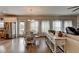 Open concept living and dining area with stainless steel appliances, island seating, and hardwood floors at 1767 Weatherbrook Cir, Lawrenceville, GA 30043