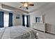 Stylish main bedroom featuring a ceiling fan and lots of natural light at 1767 Weatherbrook Cir, Lawrenceville, GA 30043