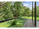 Balcony overlooking mature trees and a garden at 2105 Fairhaven Ne Cir, Atlanta, GA 30305