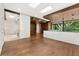 Main bedroom features wood details, an ensuite bathroom, and backyard views at 2105 Fairhaven Ne Cir, Atlanta, GA 30305