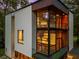 Modern home with large glass windows and wood accents, offering natural light and a great outdoor view at 2105 Fairhaven Ne Cir, Atlanta, GA 30305